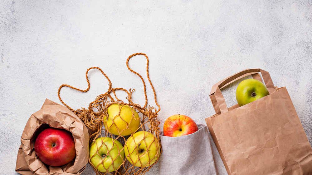 Apple Lies Between Reusable Cotton Produce Bag And Disposable Plastic Bag  Zero Waste Eco Friendly Concept Stock Photo - Download Image Now - iStock
